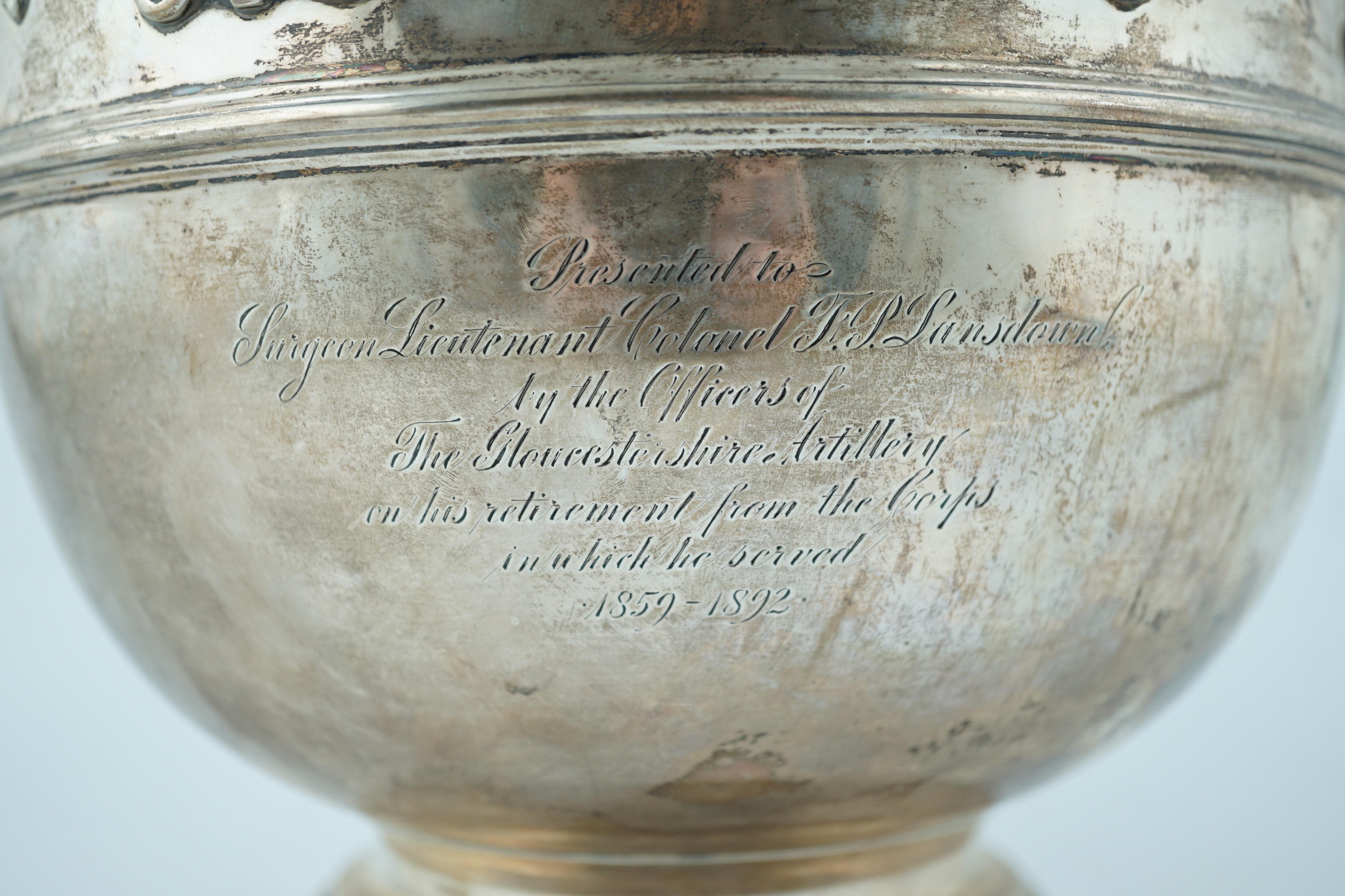 A late Victorian silver presentation Monteith by William & John Barnard, with engraved armorial and inscription related to Surgeon Lieutenant Colonel F.P. Lansdown